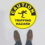 Caution Tripping Hazard Floor Sign